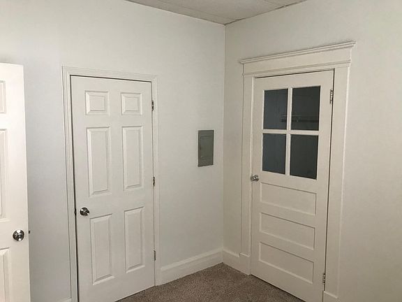 Bedroom looking at bathroom and closet doors