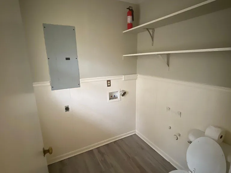 Laundry room with bonus toilet.