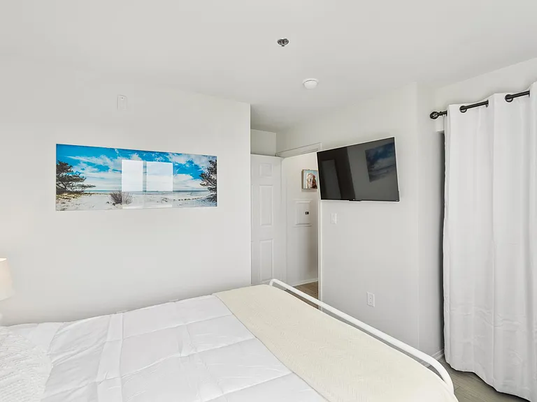 Bedroom with view of San Diego Harbor and queen-sized bed