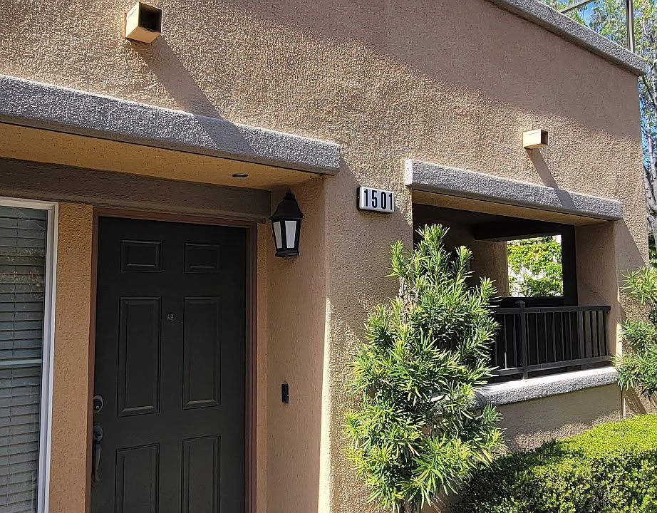 Front Door Entrance, sidewalk side, view of lower patio and upper patio deck.