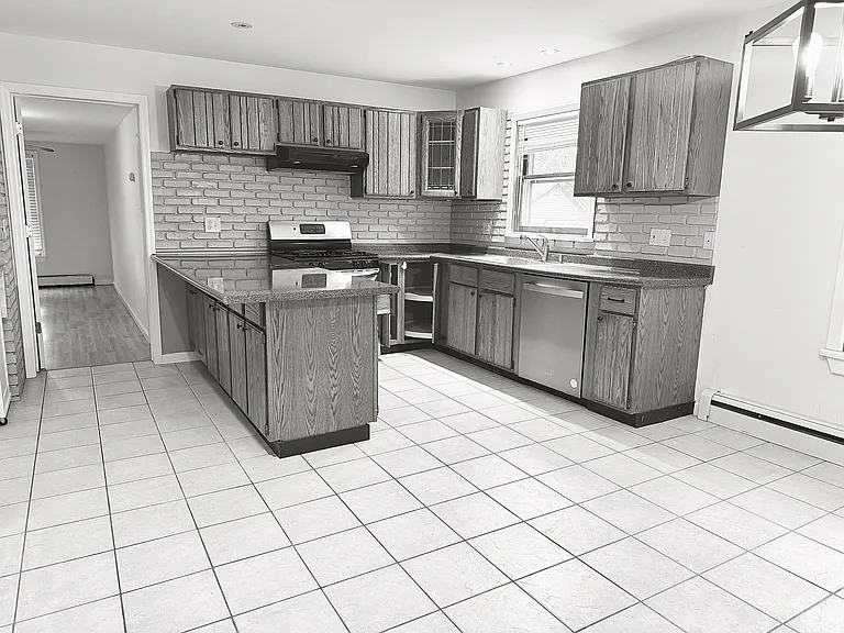 Gas range, new dishwasher, room to move in this working kitchen!