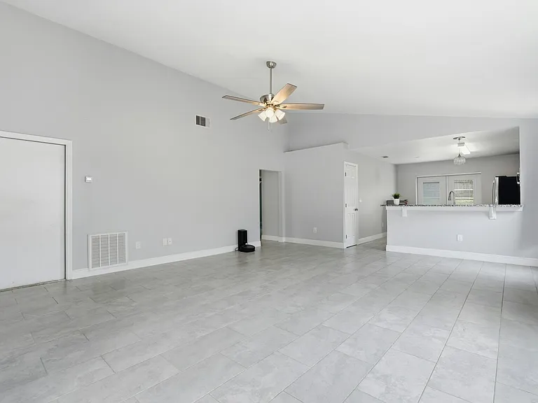 Kitchen with all stainless steel appliances, gas range, soft close cabinets & granite counter tops