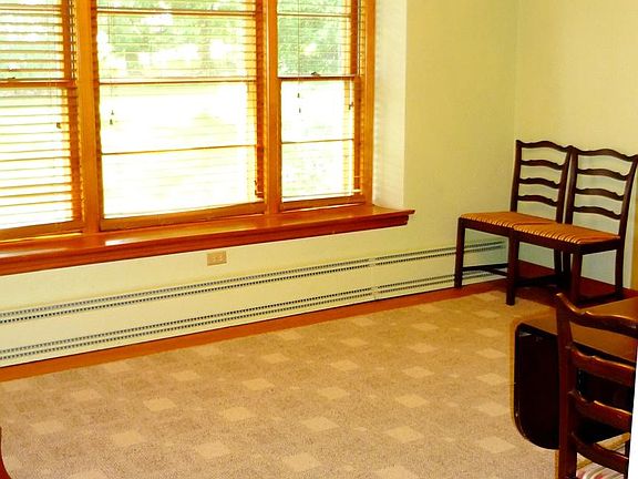 Dining room hardwood and berber carpet
