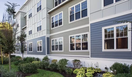 Beautiful landscaping surrounds the community - Charlesbank Apartment Homes
