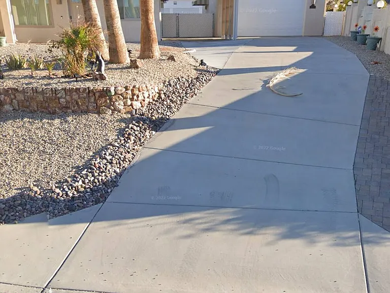 Drive to carport and detached boat garage.