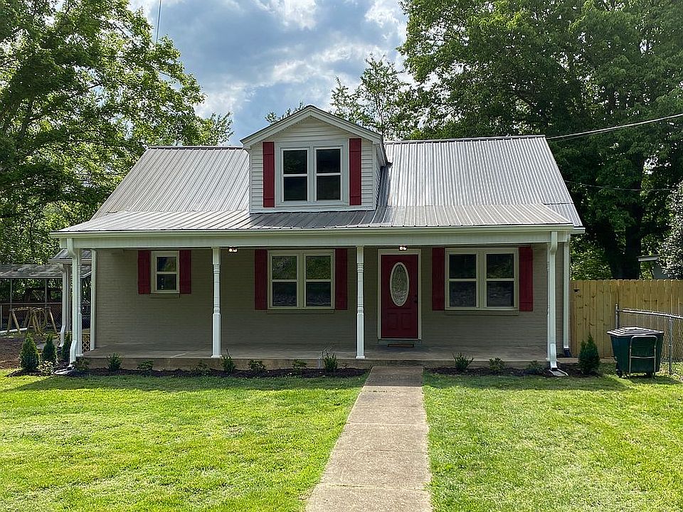 Front view with fenced yard