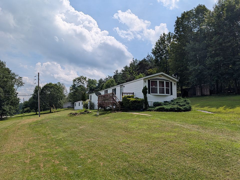 Nicely landscaped home on 1/4 acre lot with large front deck.