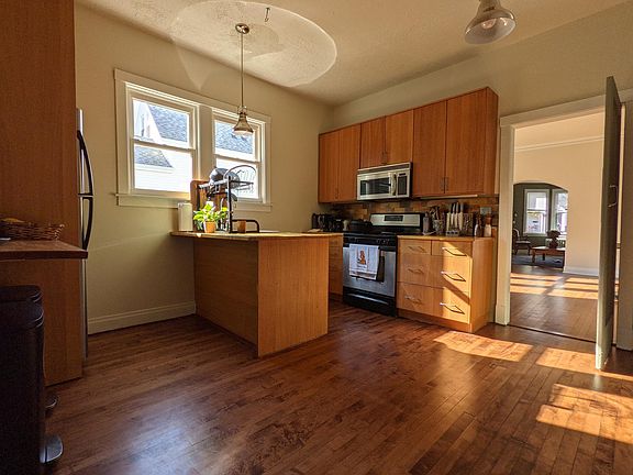 Kitchen; photo taken from back entry. Full stove, new microave