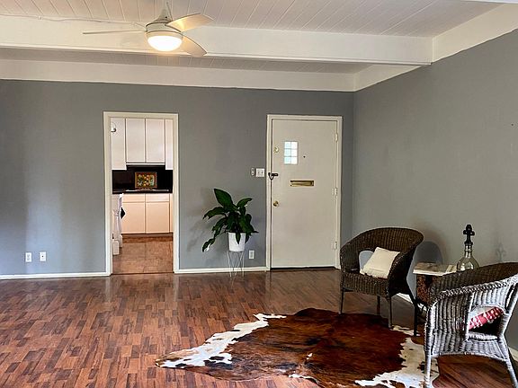 Main living with view into kitchen and of front door