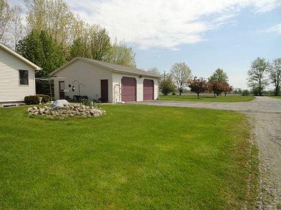 This home is nicely situated on this approximately half wooded acreage, enabling views from several rooms!