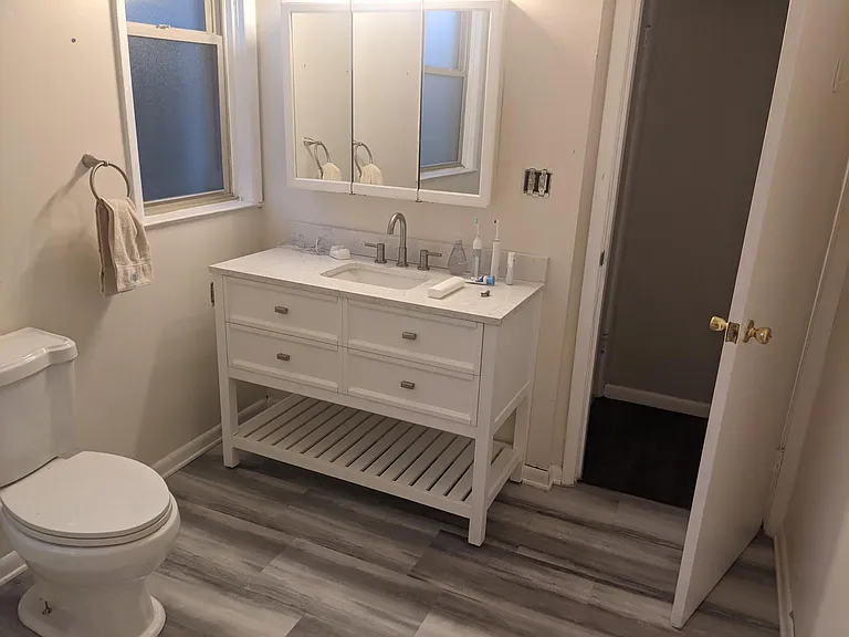 Second floor bathroom. Doors direct to primary bedroom and hallway.
