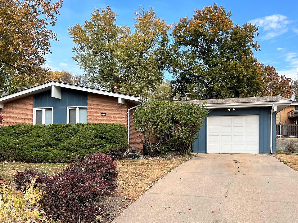 Brick and hardiplank exterior with one car garage and covered breezeway