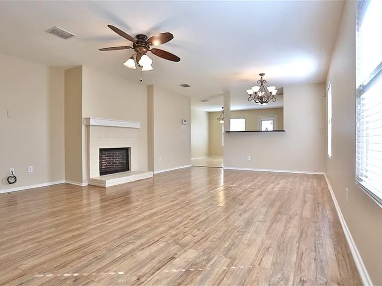 View of living room with fireplace for those chilly Texas evenings.