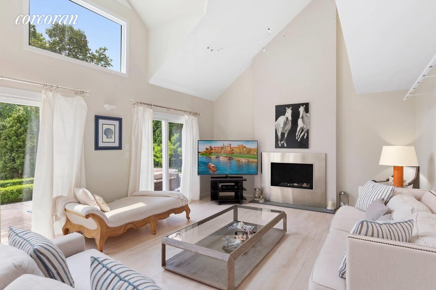  Spacious living room with fireplace and 65 inch QLED(mini-led) technology TV