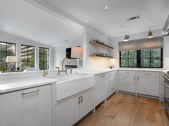 Updated kitchen with storage and custom cabinetry.