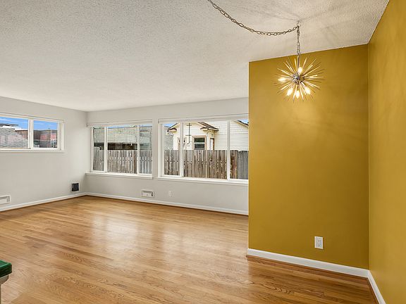 New designer lighting in bathroom, dining nook and bedroom with fresh and modern accent walls.