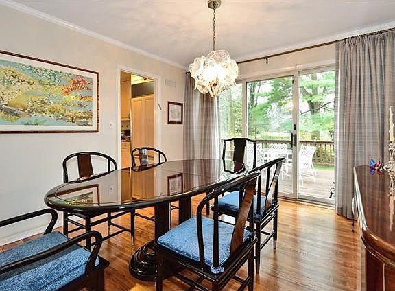 Lovely Dining Room with door to large deck and yard