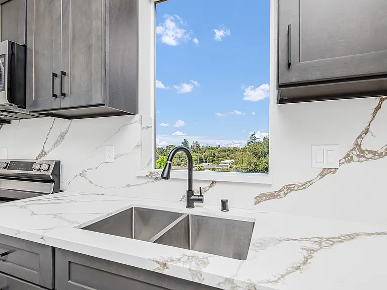 Deep double sink, soft close cabinetry