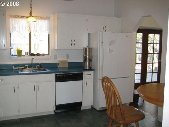 Kitchen and Eating Space, View Yard and Playground, Entrance to Dining Room