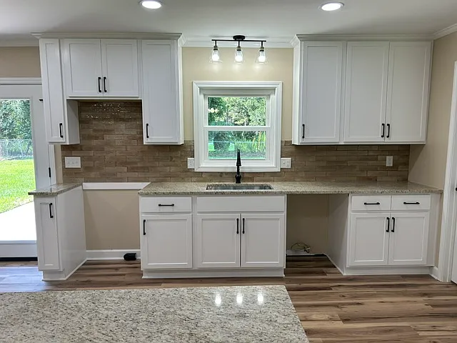Stainless steel appliances, not yet installed. Left of sink will be stove and microwave hood range. Right of sink will be dishwasher. With lease to purchase option, lessee can choose appliances up to $3000.