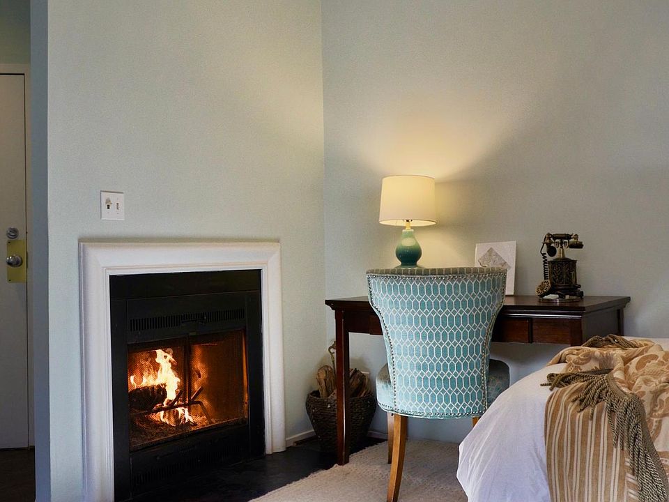 The wood burning fireplace really makes the apartment a home. Room for TV above.