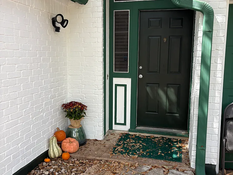 Front door painted a rich deep green.