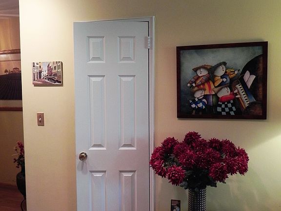 A rare one and a half bath. Powder room off entryway.