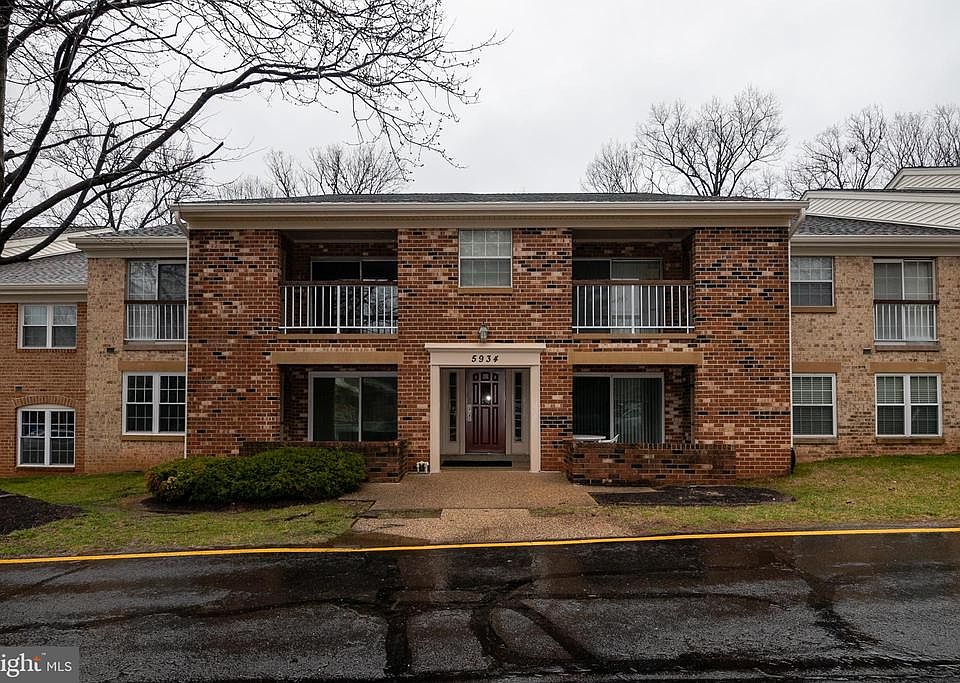 Front of building-Unit is upper left w. balcony
