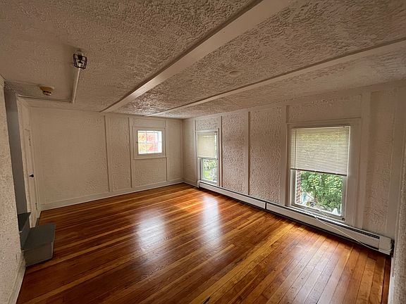 Living Room - lots of light. Square window looks out on The Village Green.