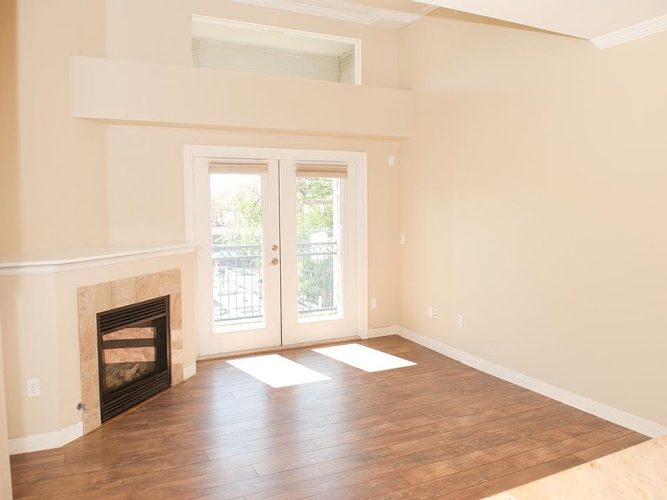 Living Room w 12' Ceiling and fireplace