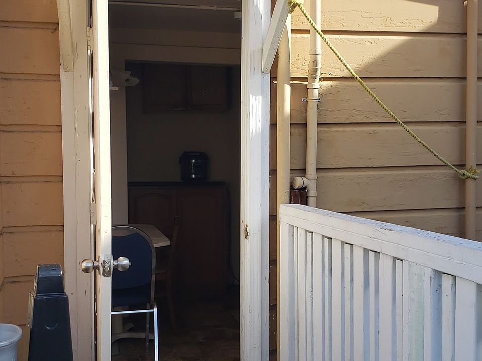 Upstairs entrance from back of building into Kitchen