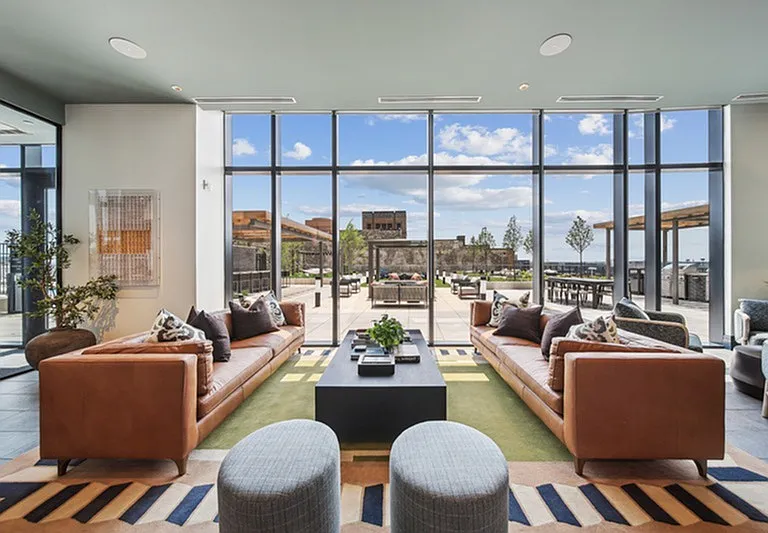 Luxe meets landscape _ a panoramic lounge where city views and inviting design shape the perfect backdrop for connection and comfort.
