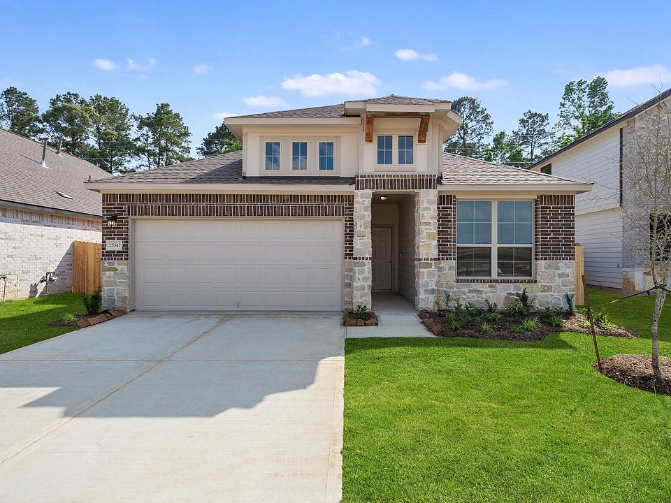 Welcome home to 25542 West Blackwater Creek Trail located in the community of Spring Creek Trails an