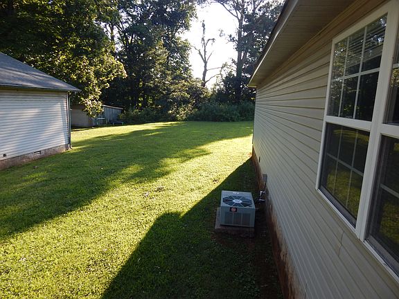 This is a view of the yard from the porch. The large back yard is shared with three buildings, each with two apartments.