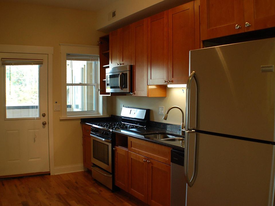 Kitchen with stainless steel appliances and granite countertops.