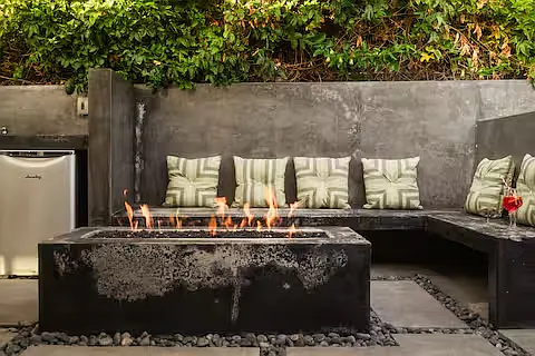 Spacious backyard packed with fun! Comfortable lounges, gather around the fire pit, cook on the pizza oven or BBQ, play the giant chess set, enjoy the playground, or watch movies on the large projector screen. Endless ways to play and unwind.