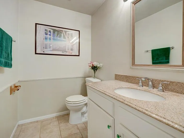 Downstairs guest bathroom next to the stairs.