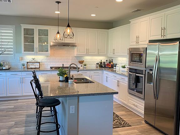 Kitchen with stainless steel appliances including refrigerator