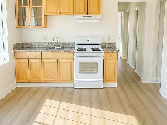 Open kitchen. Plenty of room for a table. Kitchen opens up to the spacious family/living room.