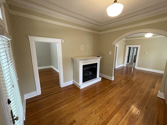 Living room looking at guest bedroom (left) and dining room (right)