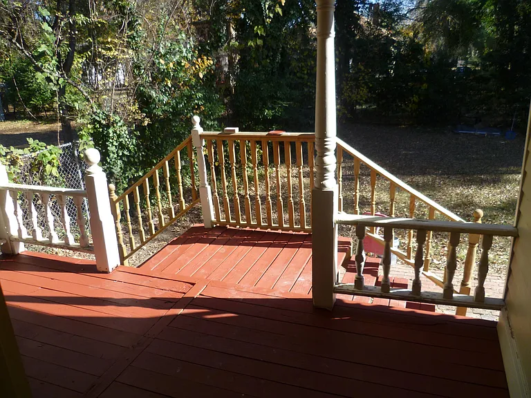 Enjoy this spacious back yard, or relax and socialize on this sizable, shaded back porch!