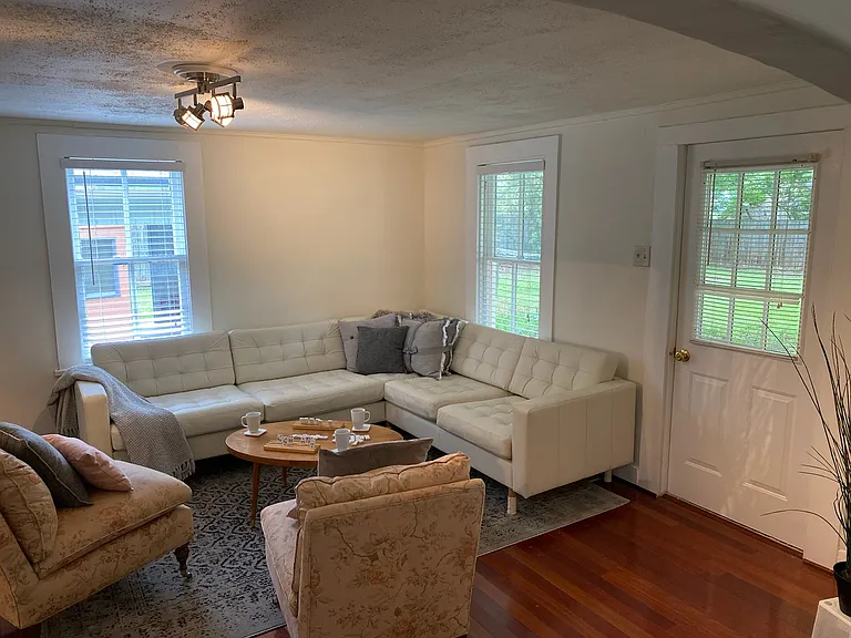 Side door leads to a very large yard.