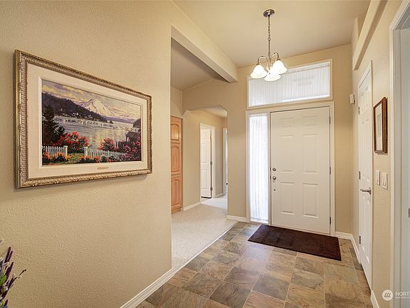 A spacious foyer offers a convenient coat closet.  There are no steps at the front entry.>
