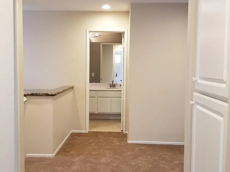 Upstairs landing with two large linen cabinets