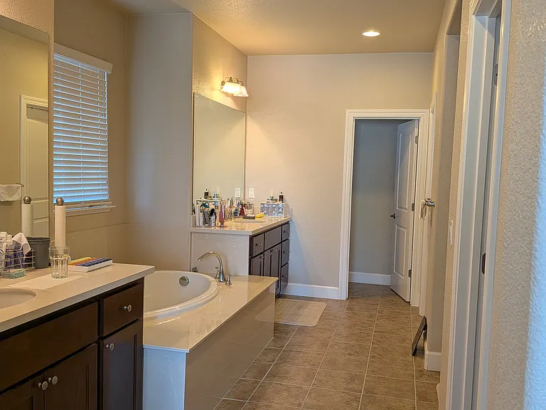 Master Bath Full View - 2 Walk in Closets and Shower on the right