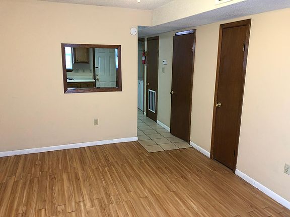 Living room has a closet and a half bath