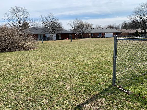 Large back yard beyond fenced in area.