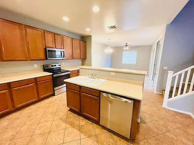 Kitchen with island and breakfast bar.