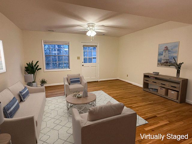 Great sized family room with a ceiling fan and door to the exterior rear patio & storage closet.