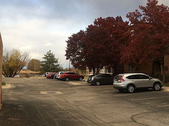 entry, parking lot and pond